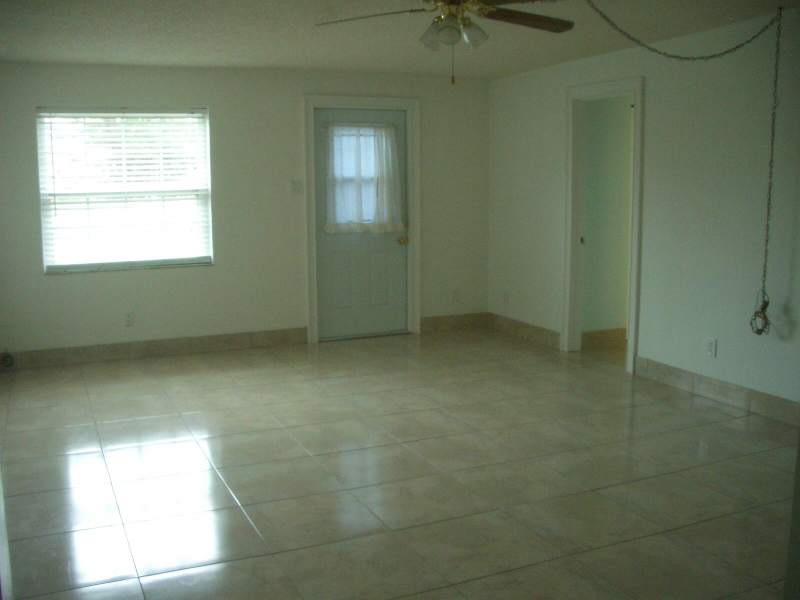 403 Daly Drive Jupiter, FL 33458 - Photo 7 of 27 a view of an empty room with a window
