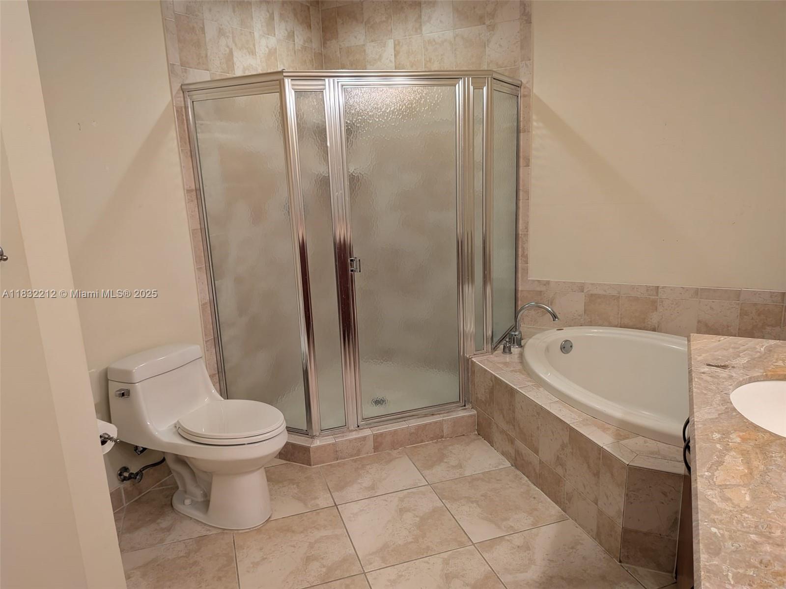 403 South Sapodilla Avenue, Unit 803 West Palm Beach, FL 33401 - Photo 20 of 23 a bathroom with a toilet and a shower