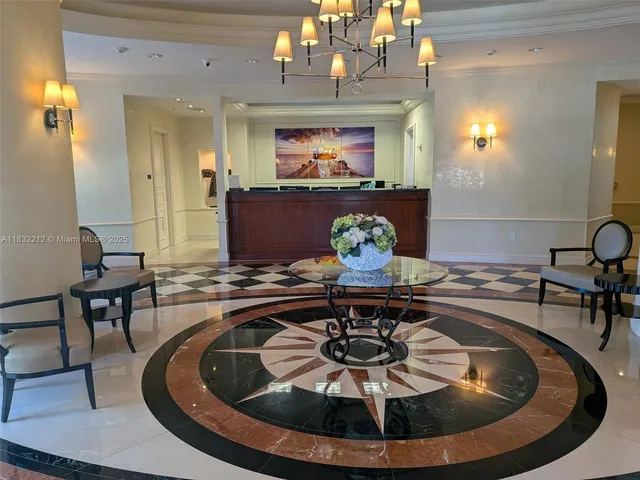 a view of a dining room with furniture a chandelier and wooden floor