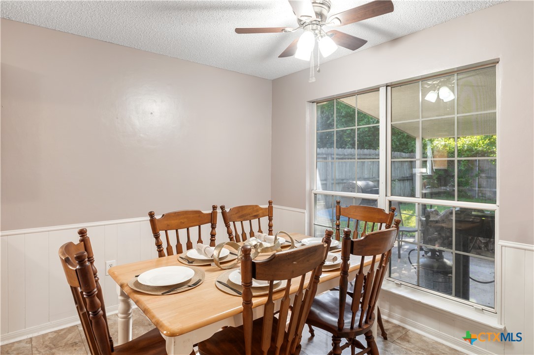 144 Jordan Loop Nolanville, TX 76559 - Photo 6 of 20 a view of a dining room with furniture and wooden floor