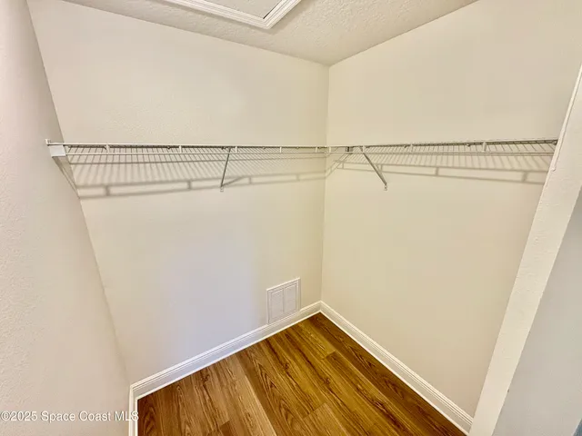 a view of a room with racks on the wall