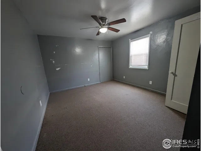 a view of a hallway with closet