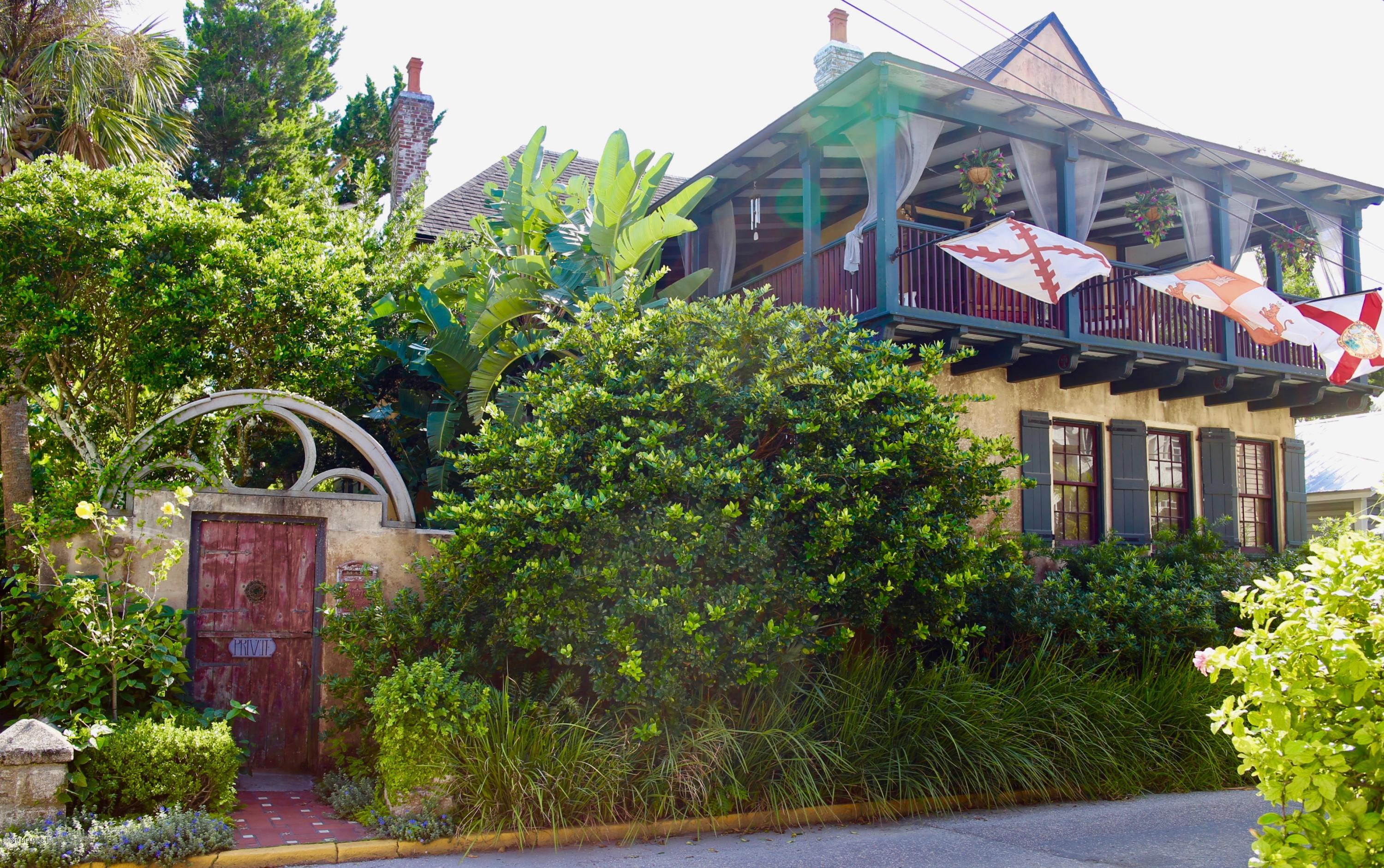15 Bridge Street St. Augustine, FL 32084 - Photo 1 of 37 a front view of a house with a garden