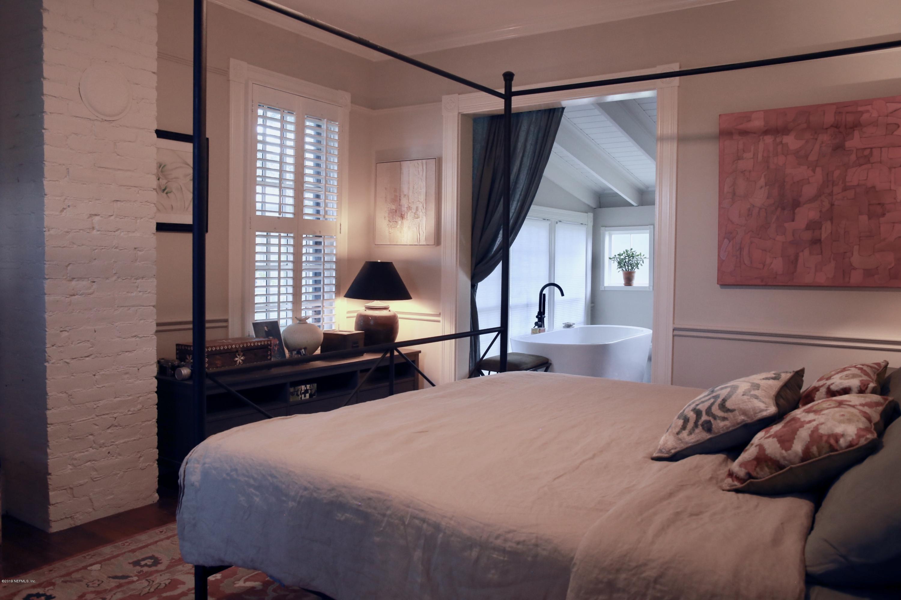 15 Bridge Street St. Augustine, FL 32084 - Photo 14 of 37 a bedroom with a bed and window