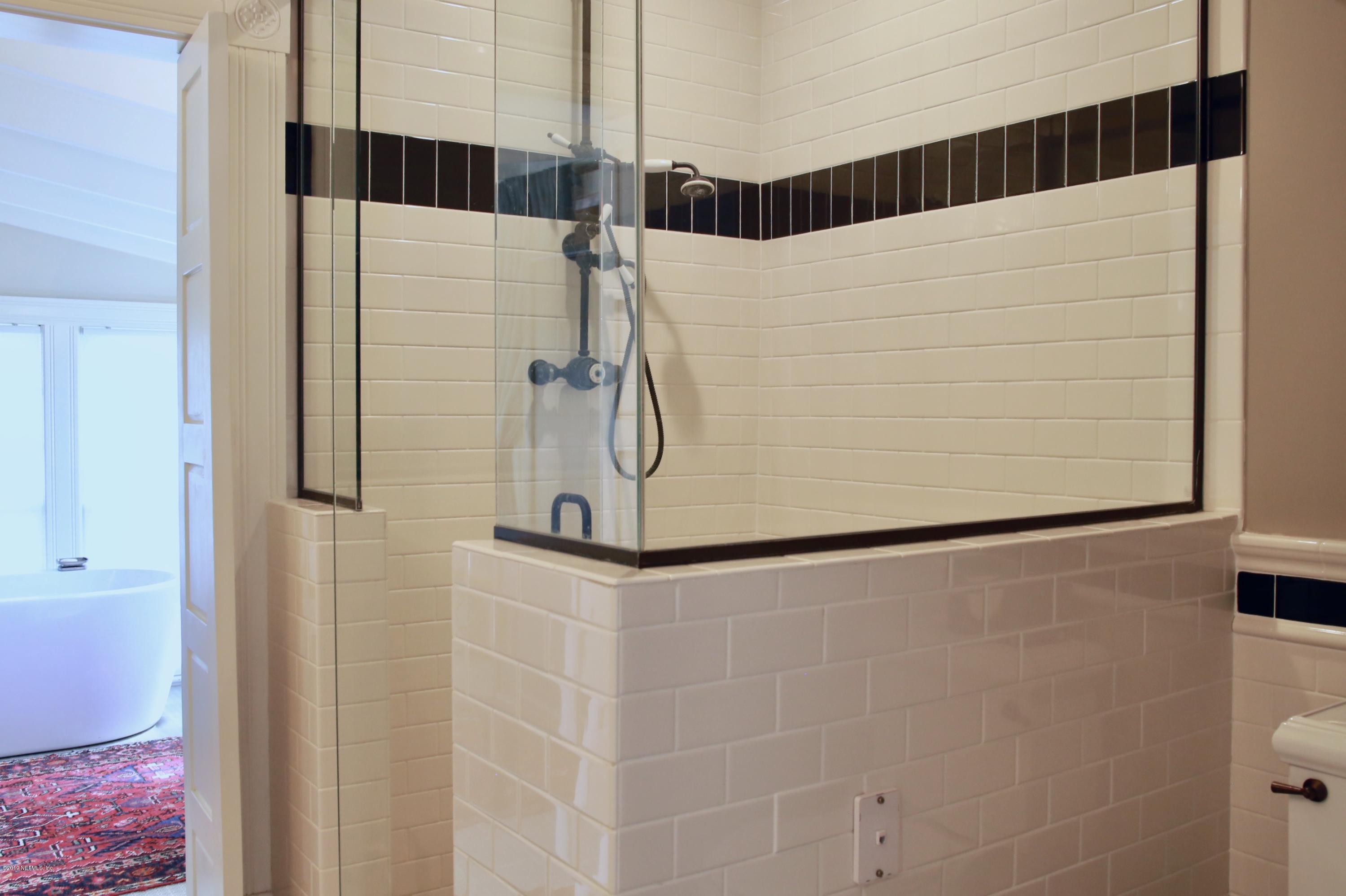 15 Bridge Street St. Augustine, FL 32084 - Photo 17 of 37 a bathroom with a shower