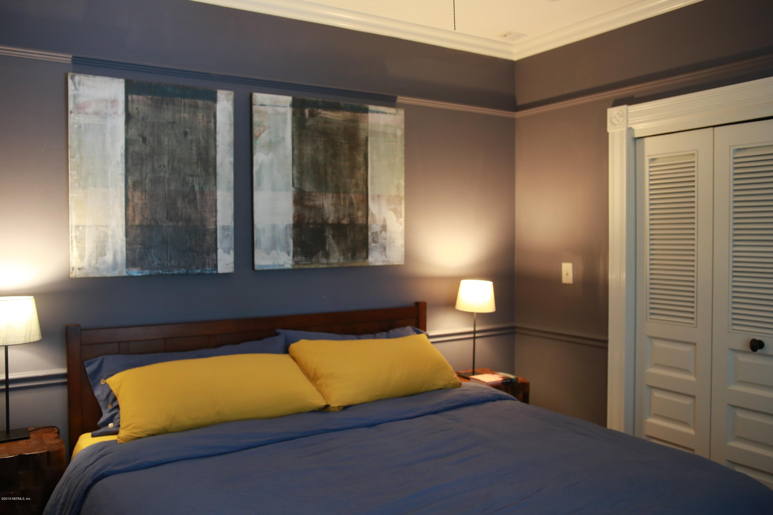 15 Bridge Street St. Augustine, FL 32084 - Photo 19 of 37 a bedroom with a bed and window