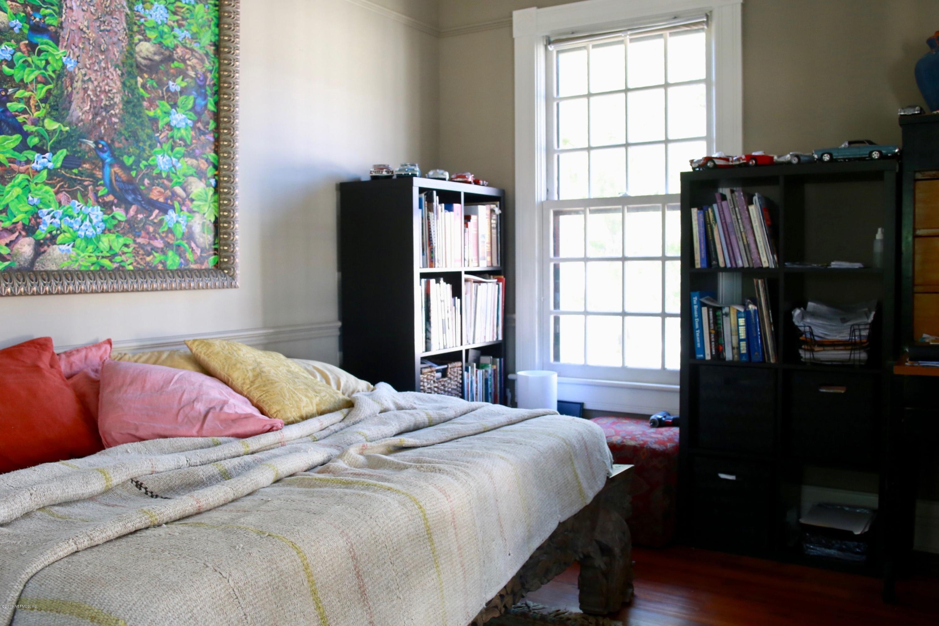 15 Bridge Street St. Augustine, FL 32084 - Photo 22 of 37 a bedroom with a bed window and a potted plant