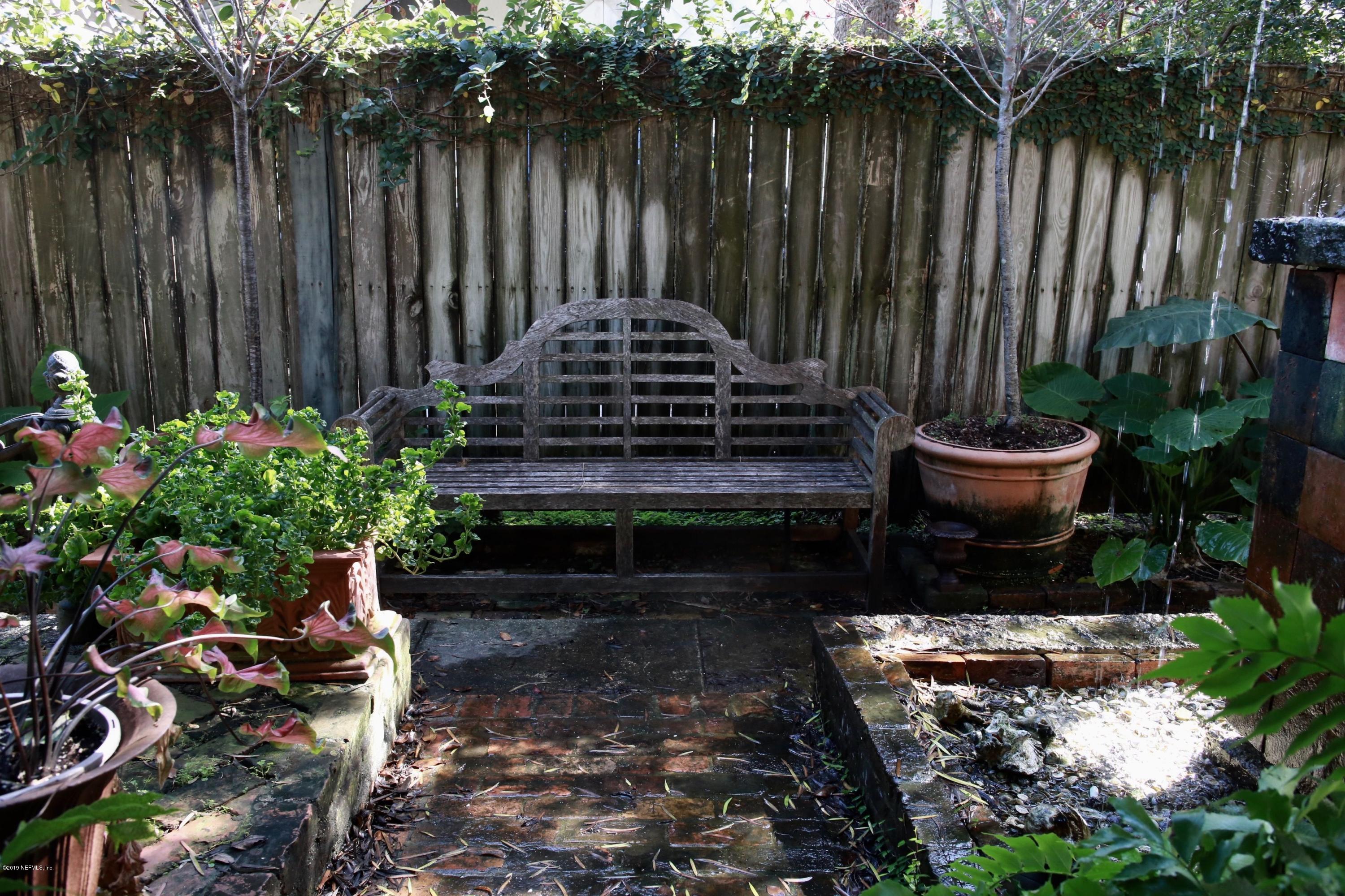 15 Bridge Street St. Augustine, FL 32084 - Photo 28 of 37 a garden filled with lots of potted plants