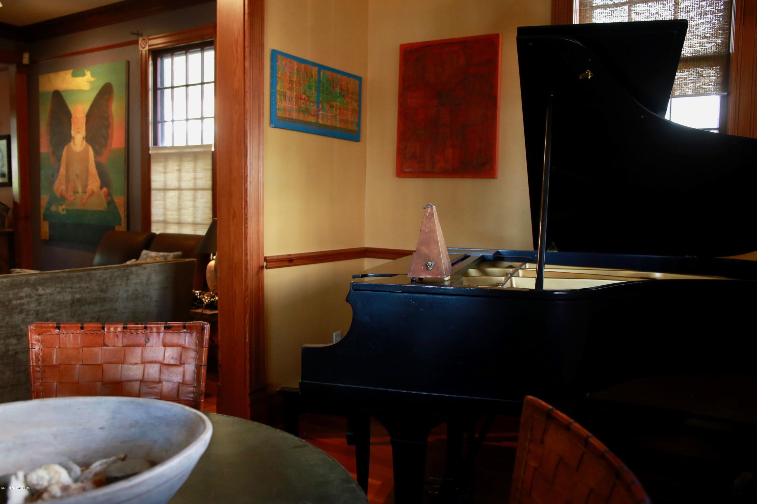 15 Bridge Street St. Augustine, FL 32084 - Photo 5 of 37 a living room with a sink furniture and a fireplace