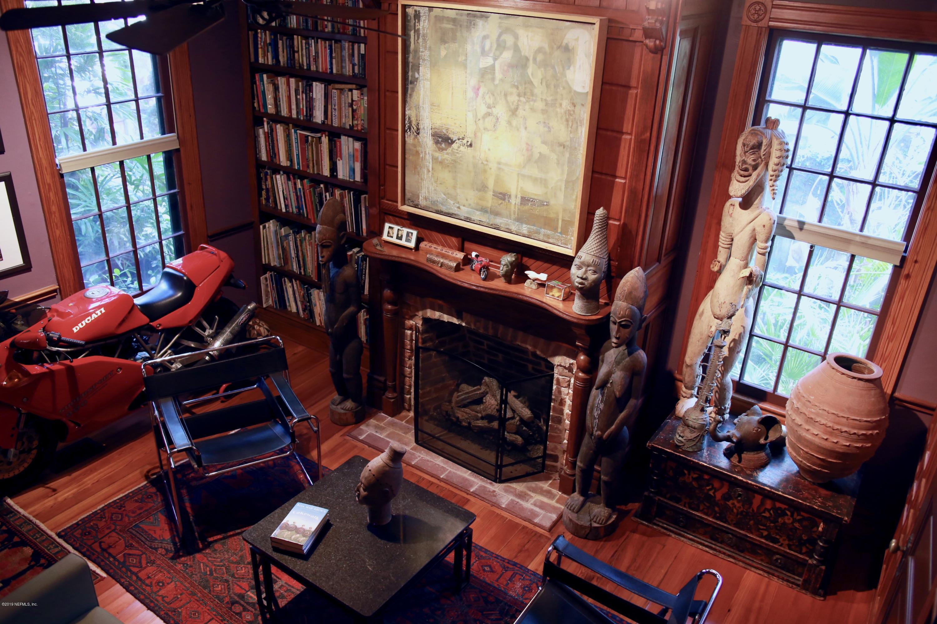15 Bridge Street St. Augustine, FL 32084 - Photo 7 of 37 a living room with furniture fireplace and a window