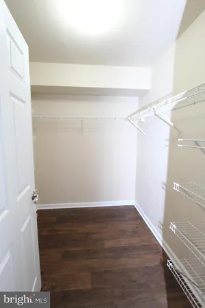 a view of an empty walk in closet