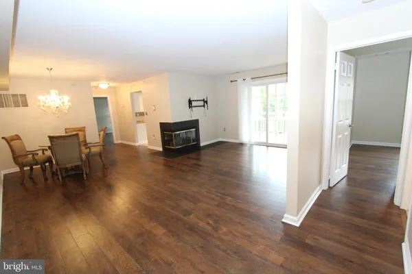 a view of a livingroom with furniture and wooden floor