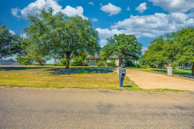 a house with trees in the background