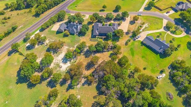 a aerial view of residential houses with swimming pool