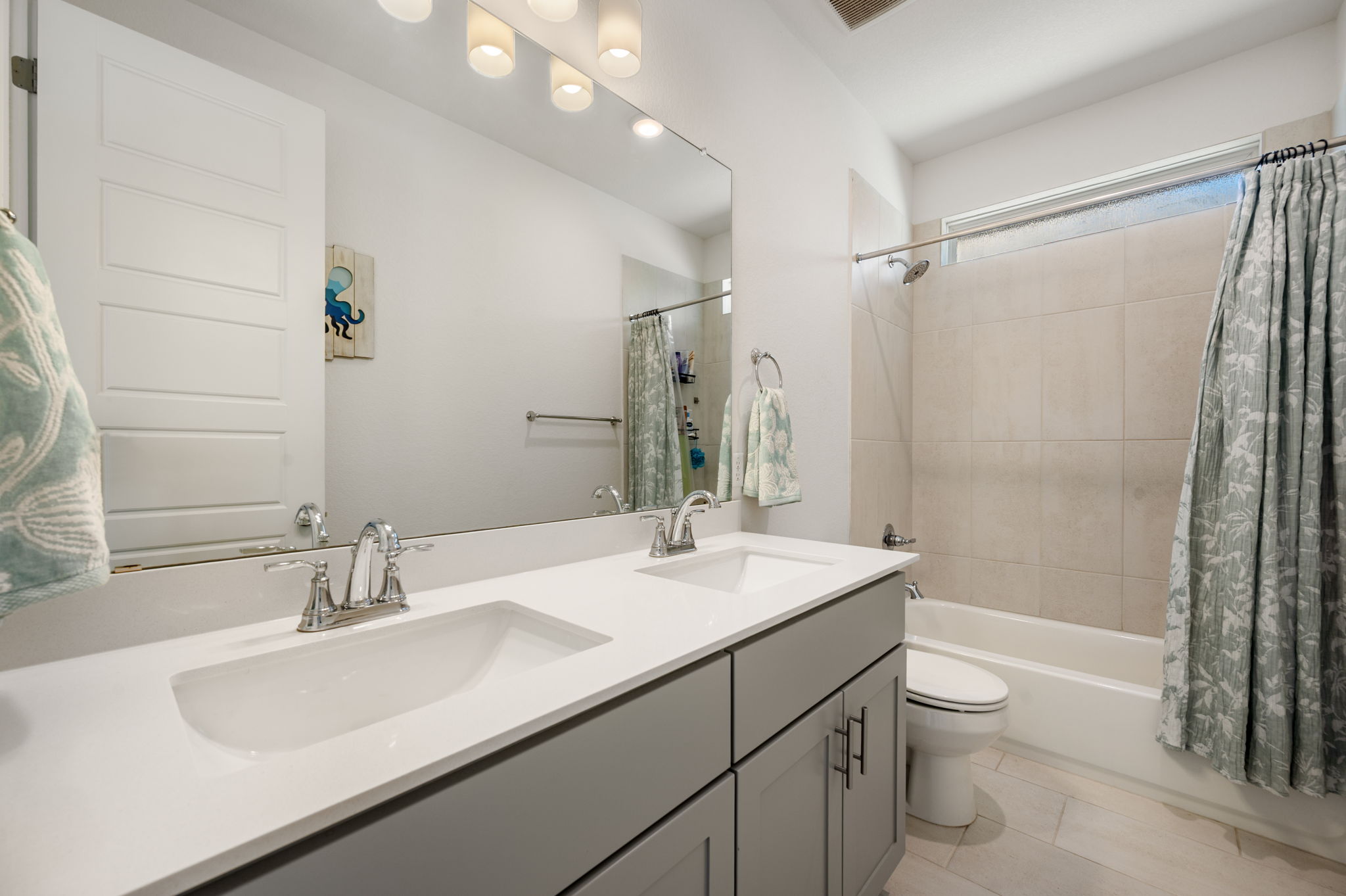256 Comfort Maple Lane Dripping Springs, TX 78620 - Photo 24 of 39 The full bath upstairs features a dual vanity.