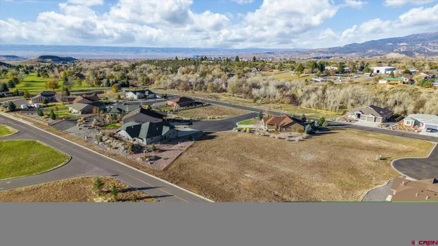 an aerial view of a house with a ocean view