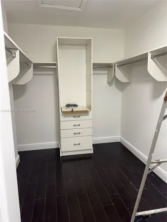 a view of an empty walk in closet