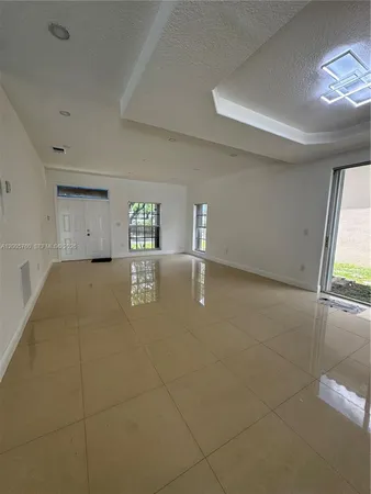 a view of an empty room and window