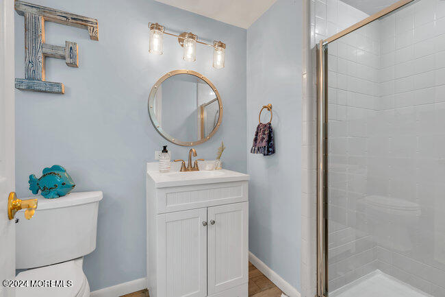 3235 Ridgewood Road Allenwood, NJ 08720 - Photo 16 of 53 a bathroom with a sink mirror and vanity