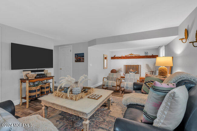 3235 Ridgewood Road Allenwood, NJ 08720 - Photo 18 of 53 a living room with furniture and a flat screen tv