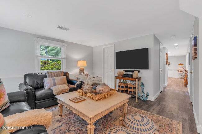 3235 Ridgewood Road Allenwood, NJ 08720 - Photo 19 of 53 a living room with furniture and a flat screen tv