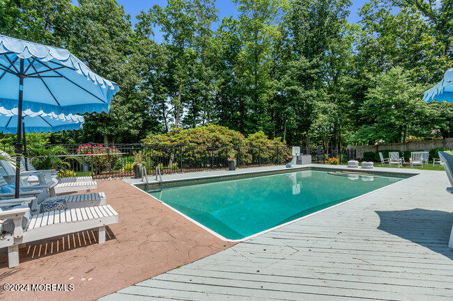 3235 Ridgewood Road Allenwood, NJ 08720 - Photo 2 of 53 a view of a swimming pool and a yard