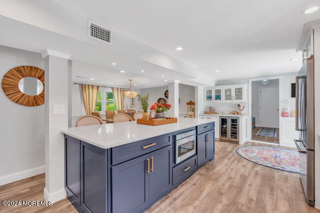3235 Ridgewood Road Allenwood, NJ 08720 - Photo 29 of 53 a kitchen with stainless steel appliances granite countertop a sink and a stove