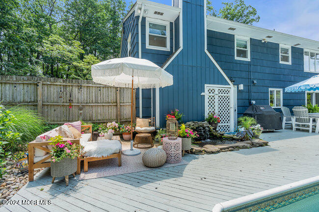 3235 Ridgewood Road Allenwood, NJ 08720 - Photo 35 of 53 a view of a chairs and tables in backyard of the house