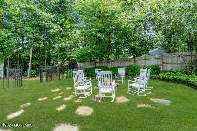 3235 Ridgewood Road Allenwood, NJ 08720 - Photo 37 of 53 a view of a chair and table in backyard