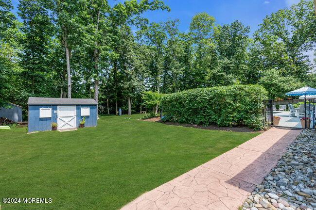3235 Ridgewood Road Allenwood, NJ 08720 - Photo 40 of 53 a view of a backyard with a garden