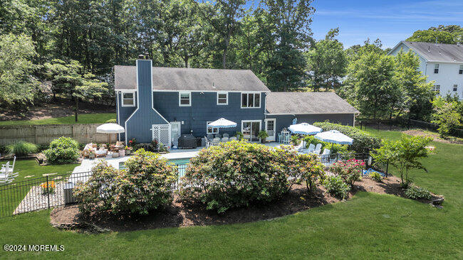 3235 Ridgewood Road Allenwood, NJ 08720 - Photo 42 of 53 a front view of a house with garden