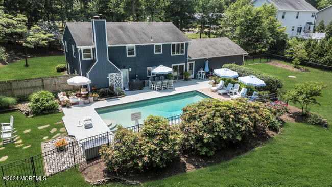 3235 Ridgewood Road Allenwood, NJ 08720 - Photo 46 of 53 an aerial view of a house with swimming pool garden and patio