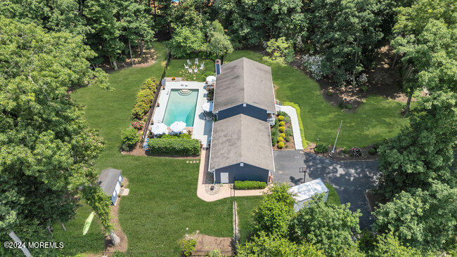 3235 Ridgewood Road Allenwood, NJ 08720 - Photo 47 of 53 an aerial view of a house with outdoor space pool seating area and yard