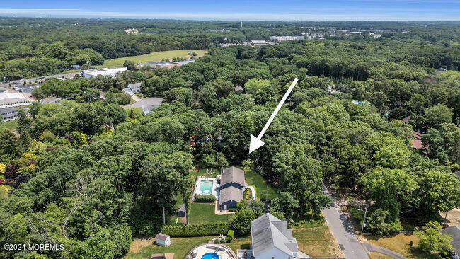 3235 Ridgewood Road Allenwood, NJ 08720 - Photo 51 of 53 an aerial view of residential houses with outdoor space and trees
