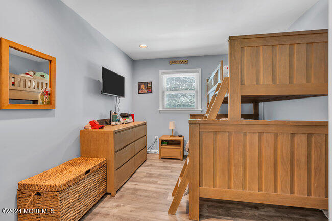 3235 Ridgewood Road Allenwood, NJ 08720 - Photo 9 of 53 a room with furniture a flat screen tv and a window