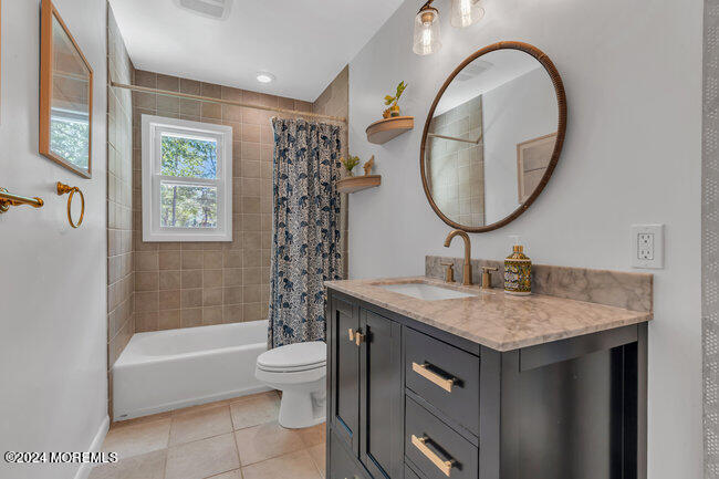 3235 Ridgewood Road Allenwood, NJ 08720 - Photo 10 of 53 a bathroom with a granite countertop sink a toilet and a mirror