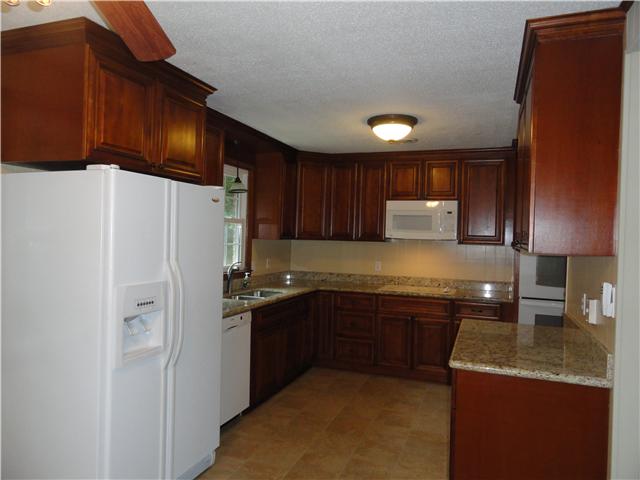 1050 Steel Springs Road Clarksville, TN 37040 - Photo 3 of 20 Stunning new birch cabinets in this large, updated kitchen complete with beautiful granite counter tops, two year old appliances including double oven, built-in microwave, stove top and refrigerator. This is a cook's dream kitchen!