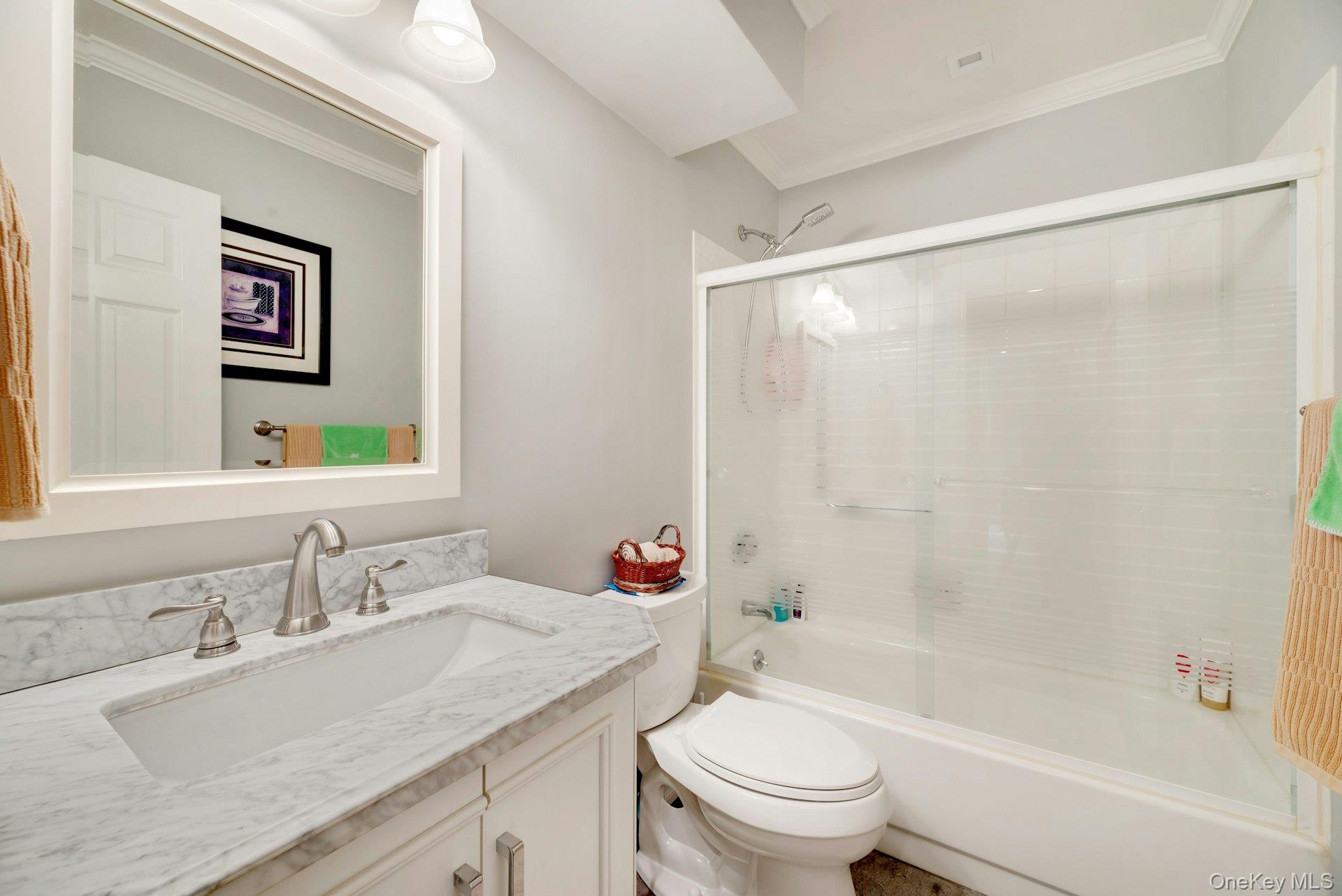 104 Glen Drive Ridge, NY 11961 - Photo 18 of 25 a bathroom with a granite countertop sink a toilet and shower