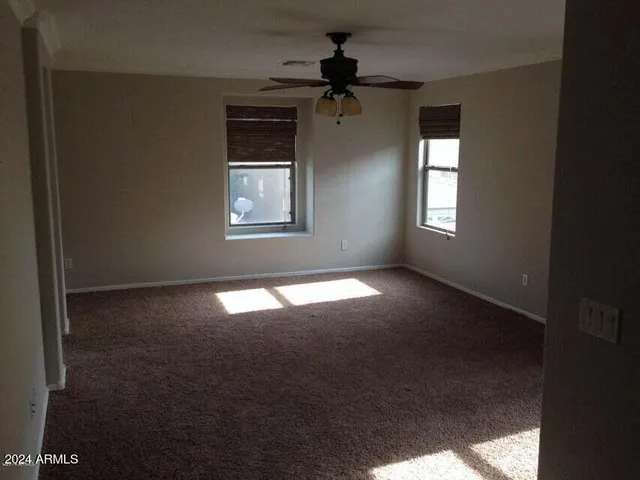 a view of empty room with windows