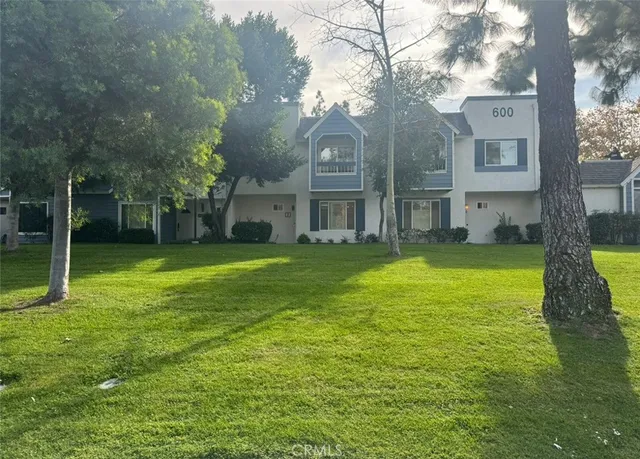 a house with garden in front of it