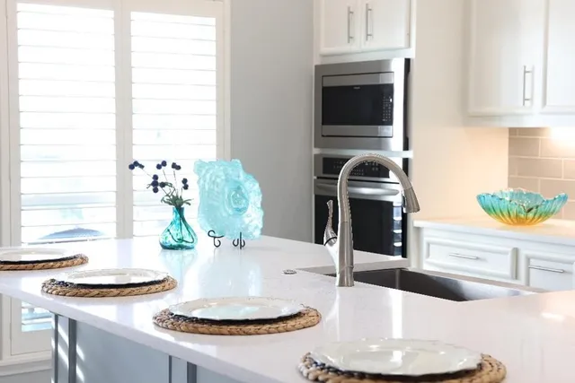 a dining room with table and chairs