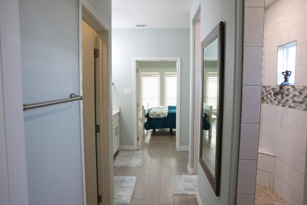 13 Southpointe Circle Rockport, TX 78382 - Photo 19 of 30 a view of a hallway with a livingroom and dining room