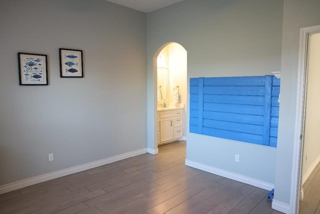 13 Southpointe Circle Rockport, TX 78382 - Photo 20 of 30 an empty room with wooden floor closet and windows