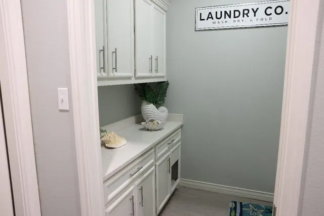 a bathroom with a sink and a cabinets