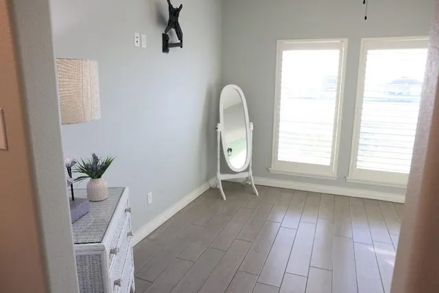 a view of an empty room with a window