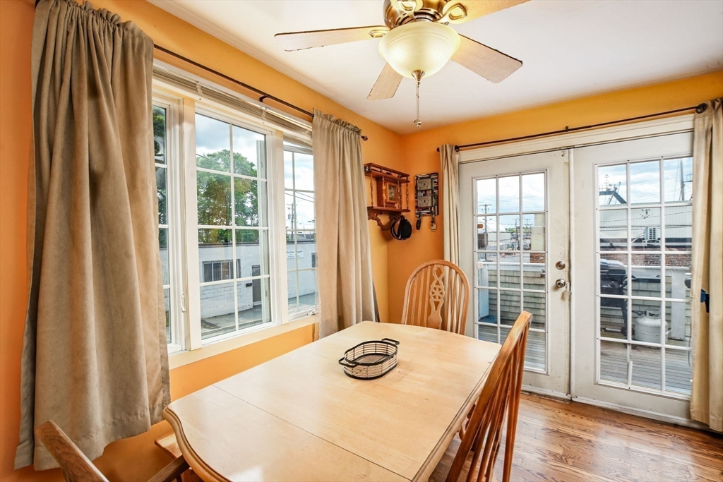 16 Middle Street Fairhaven, MA 02719 - Photo 9 of 34 a view of a dining room with furniture wooden floor and chandelier