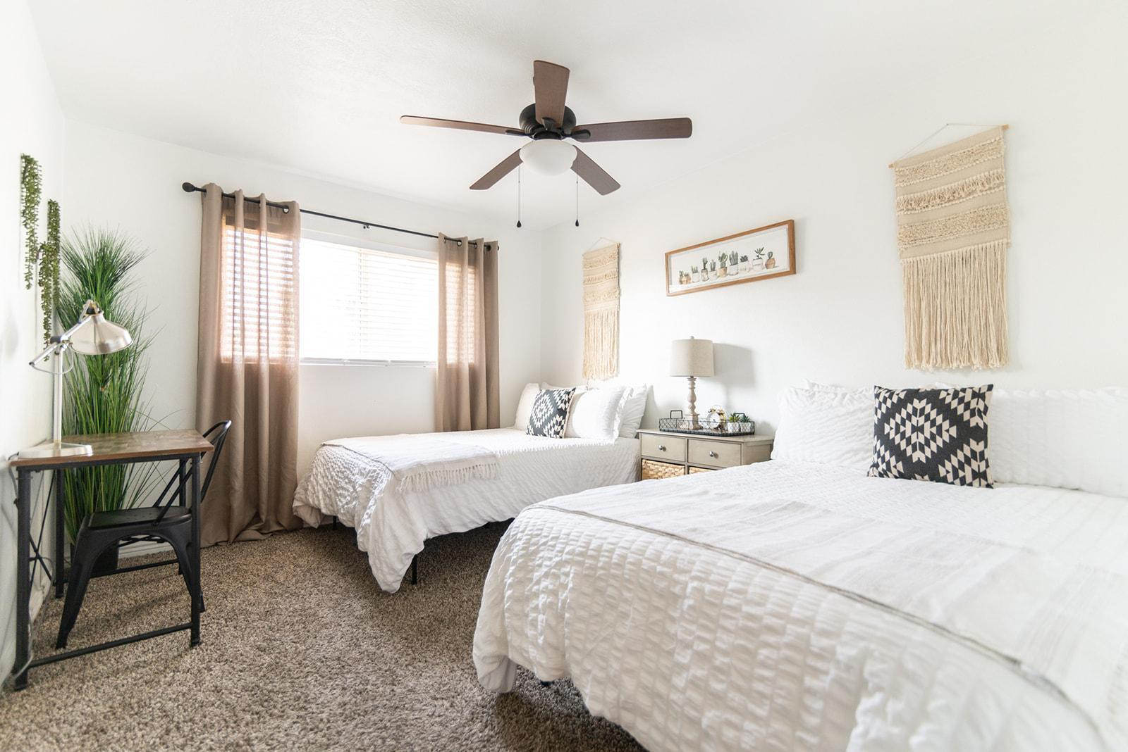7435 East Granada Road Scottsdale, AZ 85257 - Photo 25 of 28 a bedroom with two beds and a table