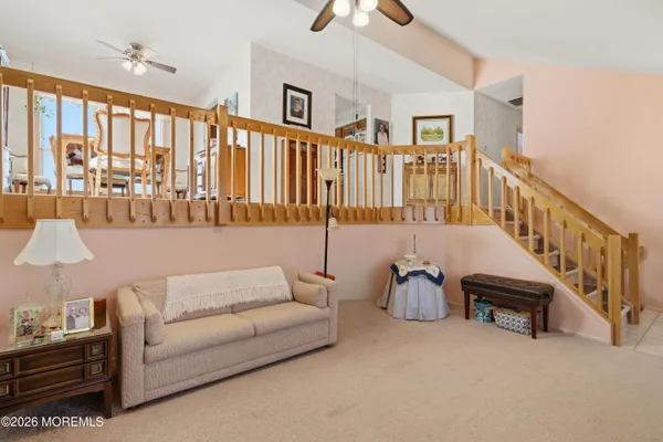 a living room with furniture or stairs and a couch