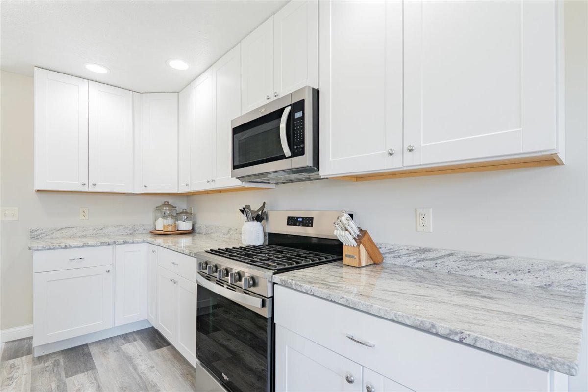 1236 Blue Bill Way Normal, IL 61761 - Photo 11 of 38 a kitchen with stainless steel appliances granite countertop white cabinets a sink and dishwasher