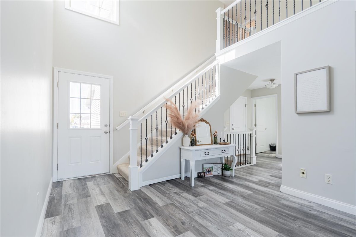 1236 Blue Bill Way Normal, IL 61761 - Photo 2 of 38 a view of entryway and hall with wooden floor